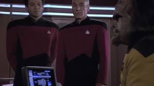 Worf at the captain's desk, where Picard and MacDuff report