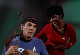 Spock playing the hard and Uhura looking at him lovingly.